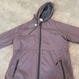Grey fleece lined new balanced medium water resistant wind resistant jacket.